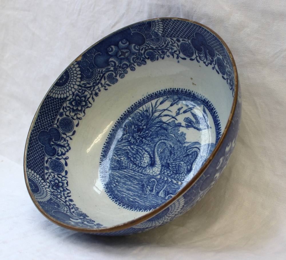 A 19th century blue and white pottery bowl, transfer decorated to the centre with two swans and - Image 2 of 5