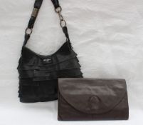 An Yves Saint Laurent brown leather clutch handbag with YSL embossed logo together with another