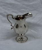 An Elizabeth II silver pedestal cream jug,