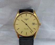 Longines - A gentleman's yellow metal wristwatch with a champagne dial, batons and date aperture,