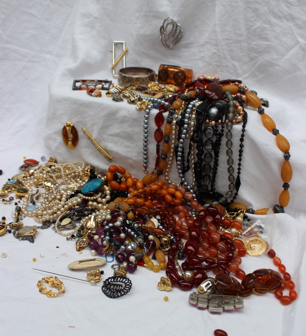 An amber necklace together with hardstone necklaces,