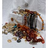 An amber necklace together with hardstone necklaces,