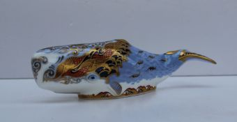 A Royal Crown Derby paperweight in the form of an oceanic whale, an exclusive for the Crown Derby
