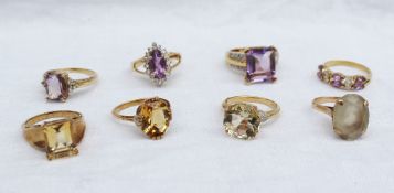 A 9ct yellow gold amethyst and topaz dress ring together with a citrine dress ring, and other