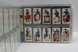 A lever arch file containing Cigarette Cards including 
W.D. & H.O.