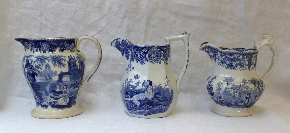 A 19th century pottery jug with blue and white transfer decoration of a setter with a game bird in