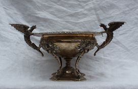 A George V silver pedestal bowl with a gadrooned rim, winged dragon handles, mask and flower head