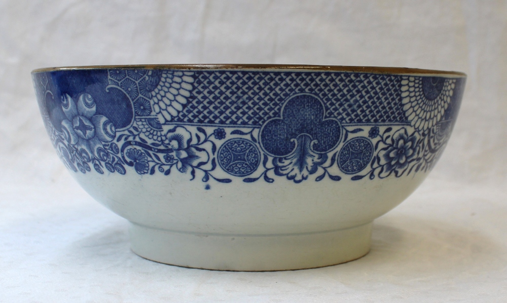 A 19th century blue and white pottery bowl, transfer decorated to the centre with two swans and - Image 3 of 5