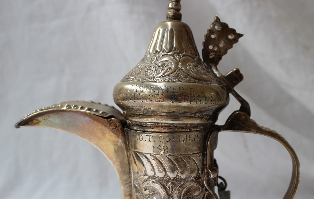 A white metal teapot, with a domed pointed lid, the body embossed with leaves and flowers, - Image 6 of 8