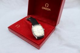 A gentleman's Omega Seamaster wristwatch, the silvered dial with batons and a date at 3, on a