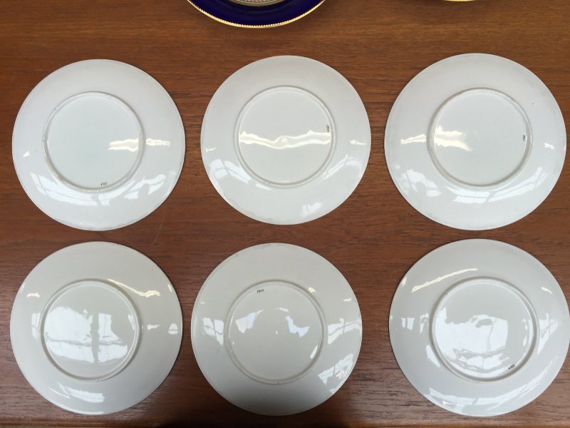 A 19th century porcelain dessert set each piece painted with landscape scenes within a Royal blue - Image 9 of 10