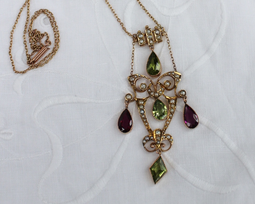 Suffragette interest - An Edwardian amethyst, seed pearl and peridot pendant, in a yellow metal