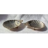 A pair of George V silver dishes of shell form on ball feet, Birmingham, 1912,