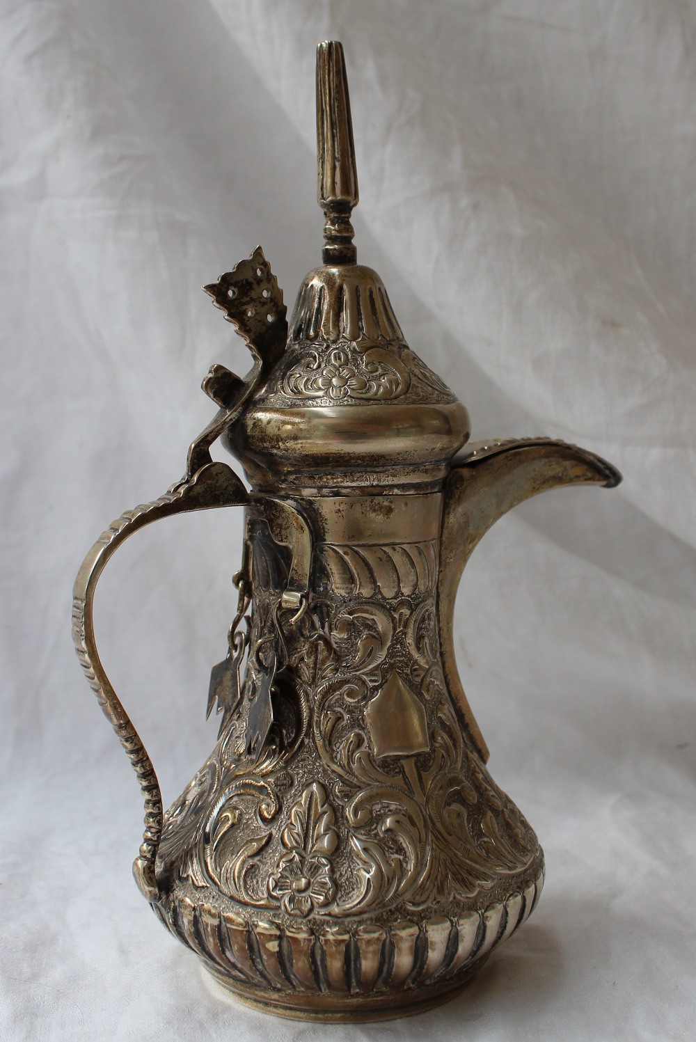 A white metal teapot, with a domed pointed lid, the body embossed with leaves and flowers, - Image 5 of 8