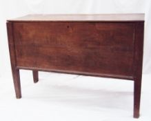 An 18th century oak coffer of rectangular form with a planked top above a planked front and sides