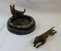 A bronze model of a terrier, standing on the edge of a circular marble ashtray, 12.