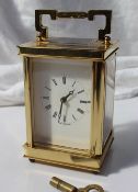 A modern brass cased carriage clock, with a lever platform escapement, the dial with Roman numerals,