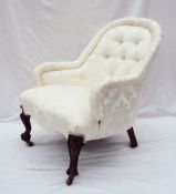 A Victorian mahogany nursing chair, the horse shoe shaped button upholstered back above a pad seat