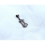 A small diamond pendant, set with four old cut diamonds in a line,