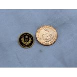 A gold quarter krugerrand dated 2012,