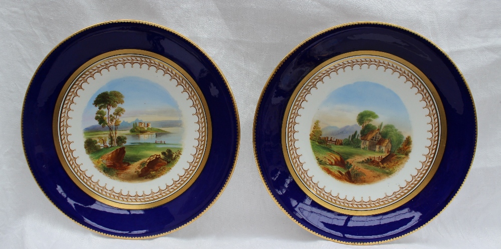 A 19th century porcelain dessert set each piece painted with landscape scenes within a Royal blue - Image 6 of 10