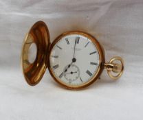 An 18ct yellow gold half hunter keyless wound pocket watch, the outer case with blue enamel Roman