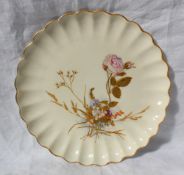 A Spode porcelain cabinet plate with raised decoration of a spray of garden flowers and leaves to an