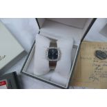 Omega - An 18ct white gold diamond set Omega De Ville lady's wristwatch, with a blue line