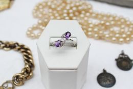 An amethyst and diamond ring, in a 9ct white gold setting together with silver gilt bracelet,