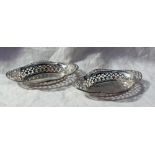 A pair of George V silver bon bon dishes of pointed oval form, with a pierced rim, Birmingham, 1913,