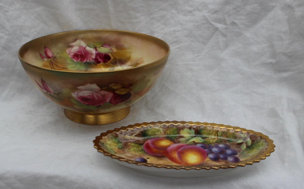A Royal Worcester porcelain bowl painted with roses and leaves to a blush ivory ground, signed R