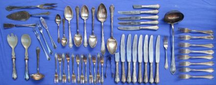 A continental white metal part flatware service, comprising a ladle, two large serving spoons,