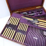 An electroplated oak cased flatware service, comprising twelve table forks, twelve table knives,