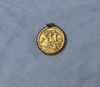 A George V gold half sovereign dated 1911, in a 9ct yellow gold slip mount, approximately 4.