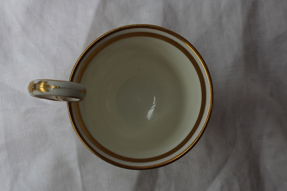 A 19th century porcelain trio, comprising  coffee cup, tea cup and saucer all painted with gilt urns - Image 5 of 9