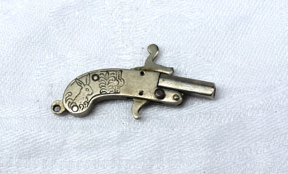 A miniature pistol engraved to one side with the head of a stag, to the other with a rabbit, 3. - Image 4 of 4