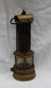 An Evan Thomas of Aberdare Davy miners' safety lamp with an iron gauze flue section the base with a
