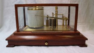 A Mahogany Cased Barograph by Russell of Norwich, with seven section vacuum, clockwork mechanism,