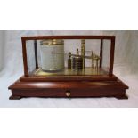 A Mahogany Cased Barograph by Russell of Norwich, with seven section vacuum, clockwork mechanism,