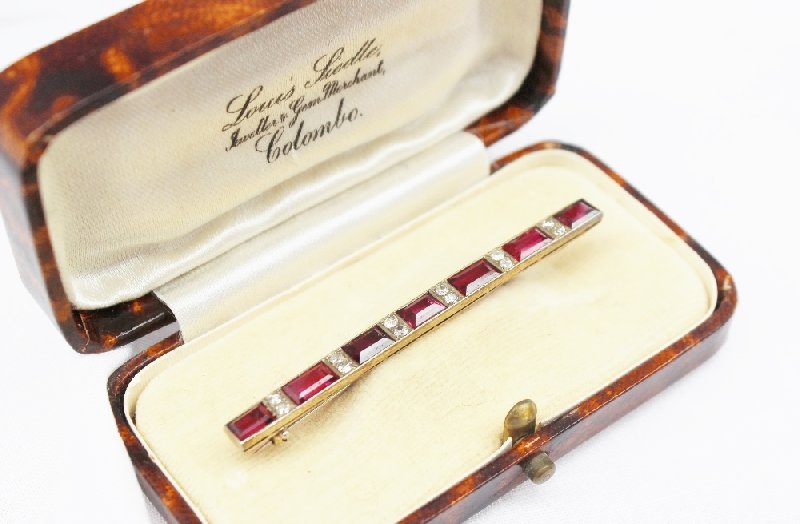 A ruby and diamond bar brooch,