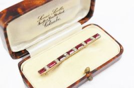 A ruby and diamond bar brooch,