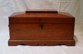 A 19th century oak tea caddy,