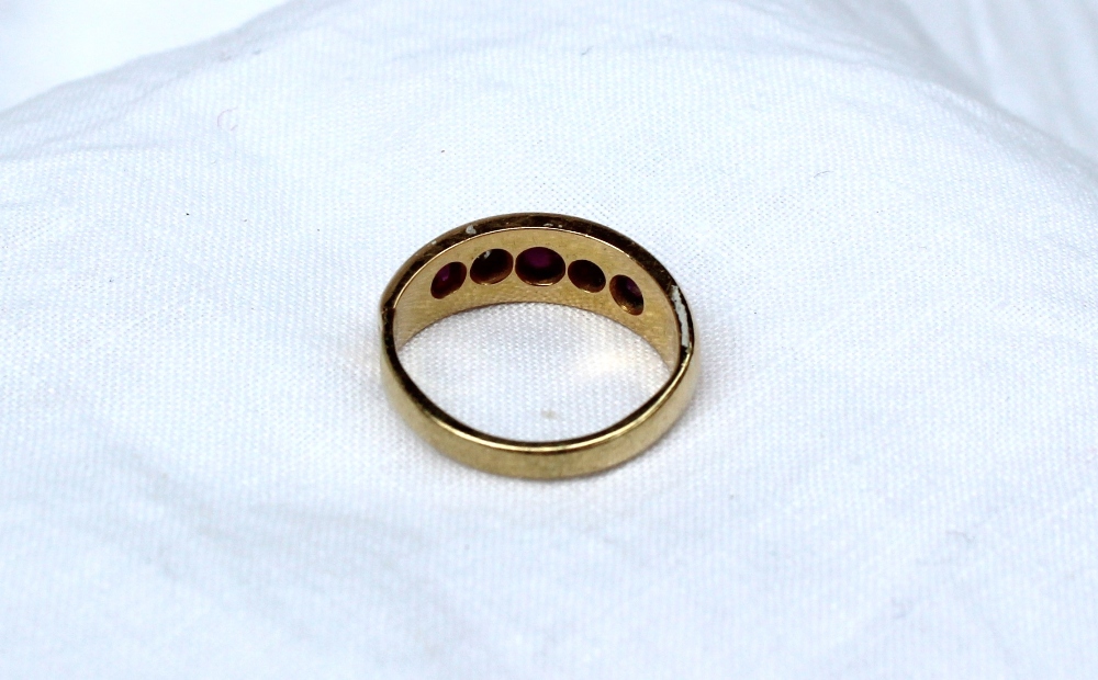 A yellow metal gypsy ring set with three rubies and two old cut diamonds, marked 18ct, - Image 2 of 3