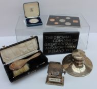 A George VI silver hairbrush, London, 1947, cased, together with a silver desk inkwell,