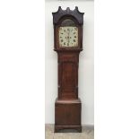 A 19th oak longcase clock, the hood with fluted columns, above a long trunk door, box base and