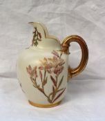 A Royal Worcester porcelain flatback jug, transfer and infil decorated with flowers and leaves, with