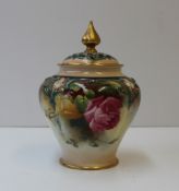 A Royal Worcester porcelain pot pourri vase and cover, the cover with a pointed gilt finial and