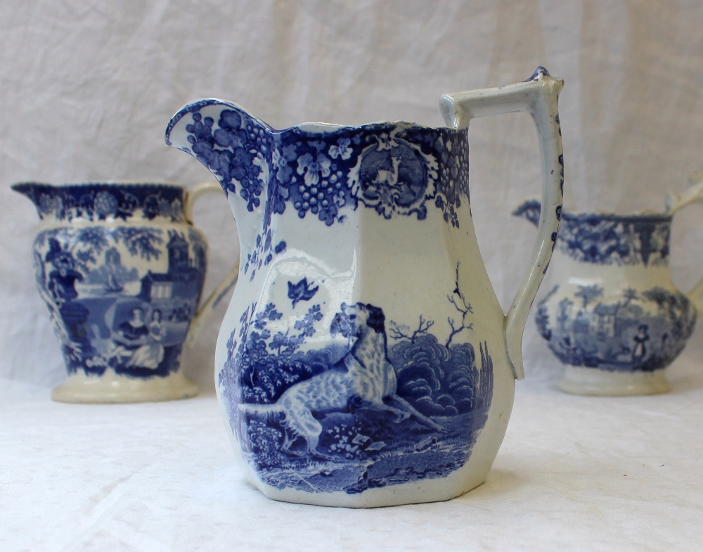 A 19th century pottery jug with blue and white transfer decoration of a setter with a game bird in - Image 4 of 9
