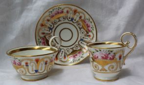 A 19th century porcelain trio, comprising  coffee cup, tea cup and saucer all painted with gilt urns
