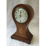 An Edwardian mahogany balloon shaped mantle clock, the circular dial with Arabic numerals,